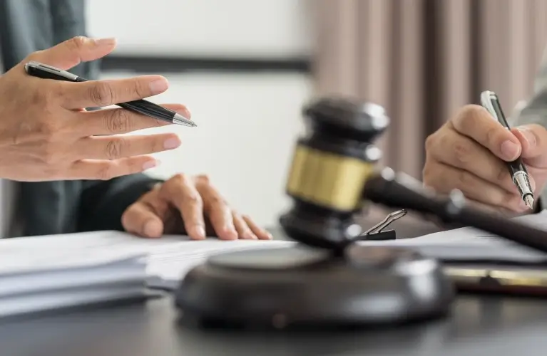 a gavel and scales on a table