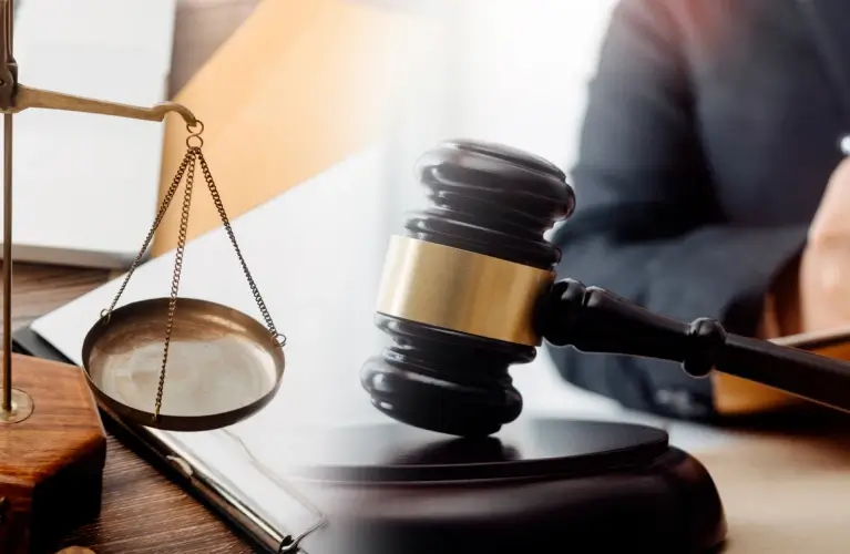 a gavel and scales on a table